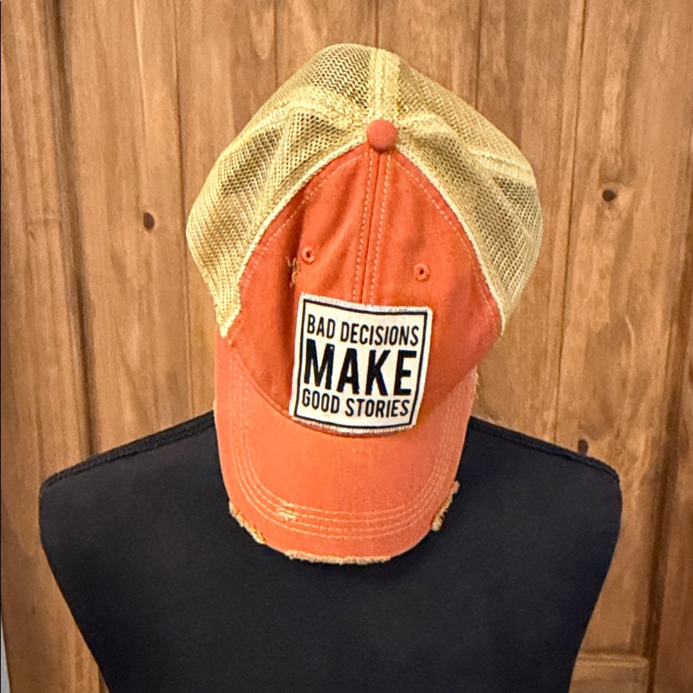 Orange Trucker Hat with 'Bad Decisions Make Good Stories' Patch